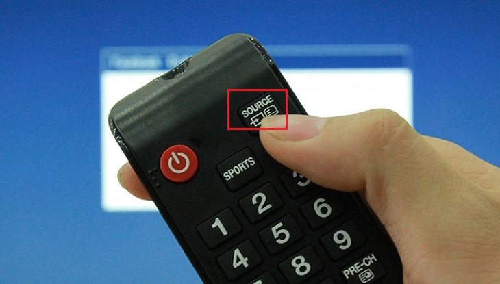 Nhấn nút Source (hay INPUT) trên remote tivi.